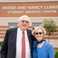 President Emeritus Arend and Nancy Lubbers in front of the Arend and Nancy Lubbers Student Services Center